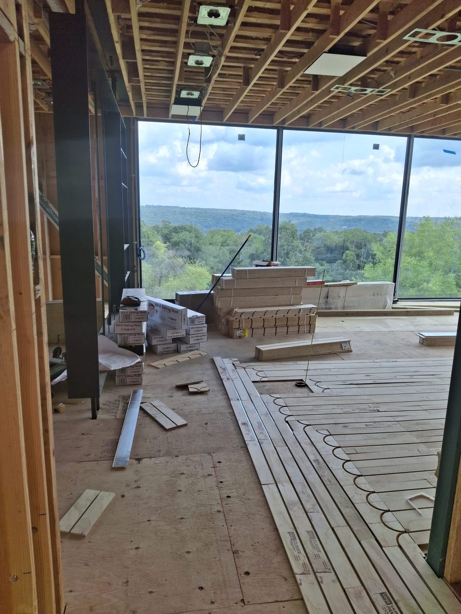 Radiant heated floor preparation in a Connecticut custom home