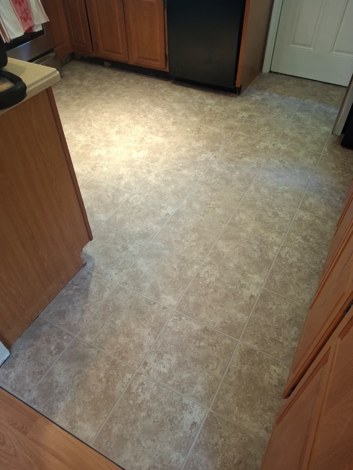Finished ceramic tile kitchen floor installation in Connecticut